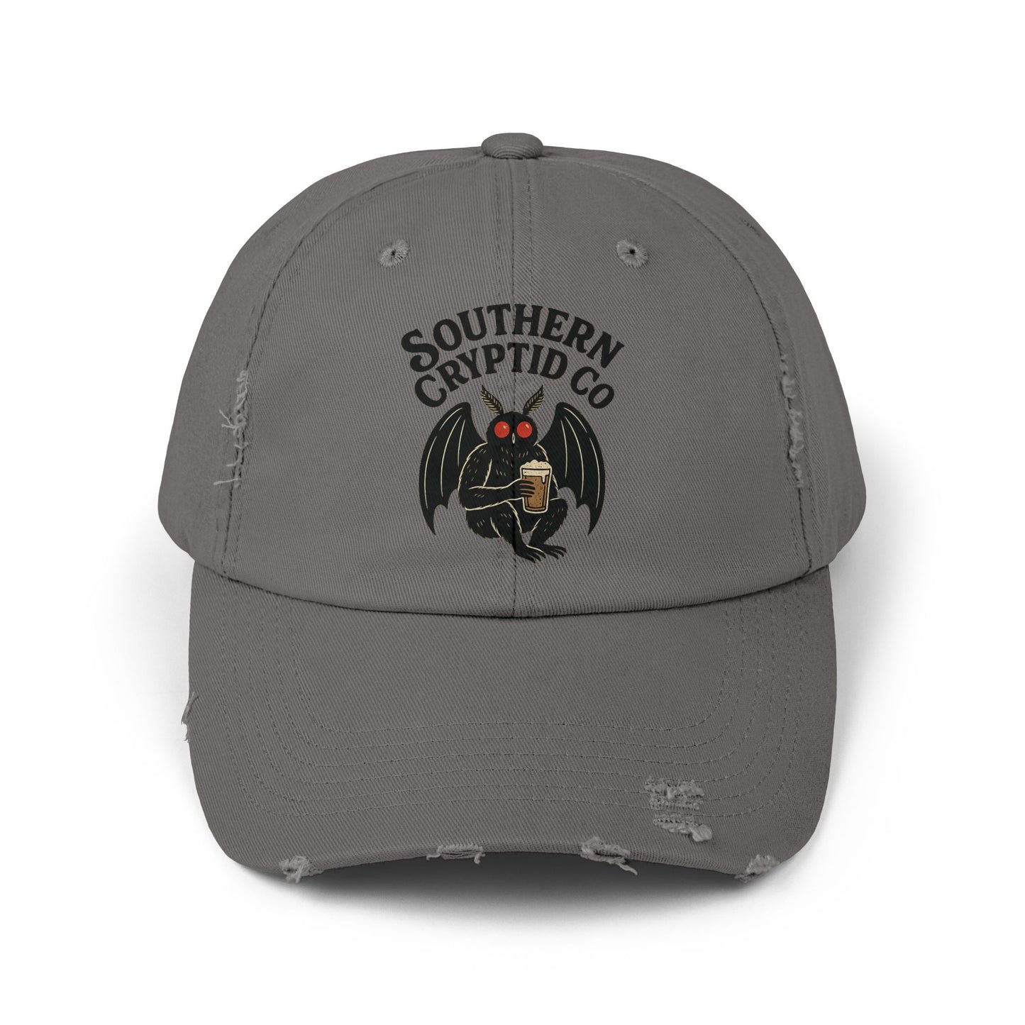 Distressed dad hat with Southern Cryptid Co. logo featuring Mothman holding a pint of beer.